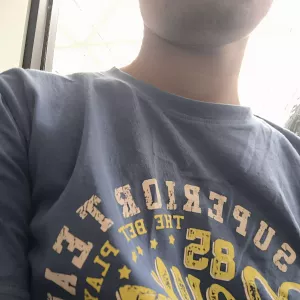 A close-up of a repaired and mended T-shirt